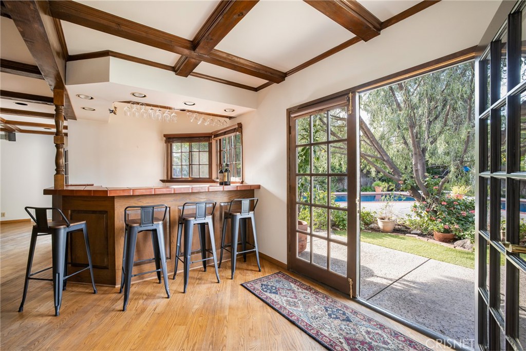23629 Long Valley Road Hidden Hills, CA 91302 - Photo 12 of 26 a view of a dining room with furniture window and wooden floor
