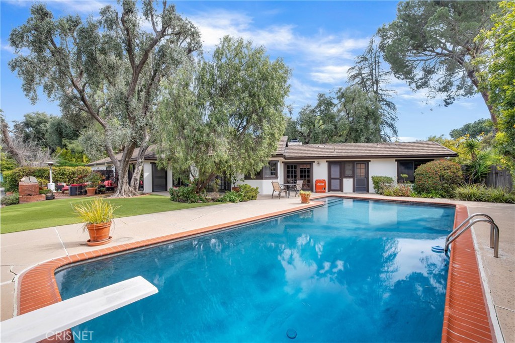 23629 Long Valley Road Hidden Hills, CA 91302 - Photo 15 of 26 a front view of house with yard swimming pool and green space