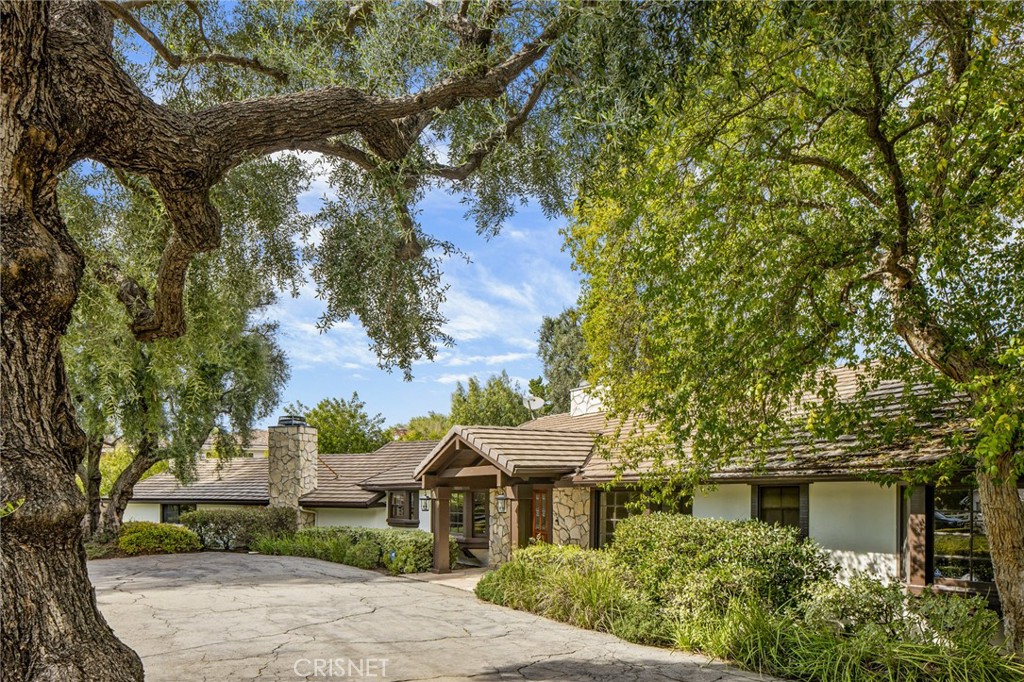 23629 Long Valley Road Hidden Hills, CA 91302 - Photo 22 of 26 front view of a house with a yard