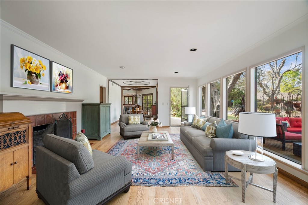 23629 Long Valley Road Hidden Hills, CA 91302 - Photo 5 of 26 a living room with furniture large window and a table