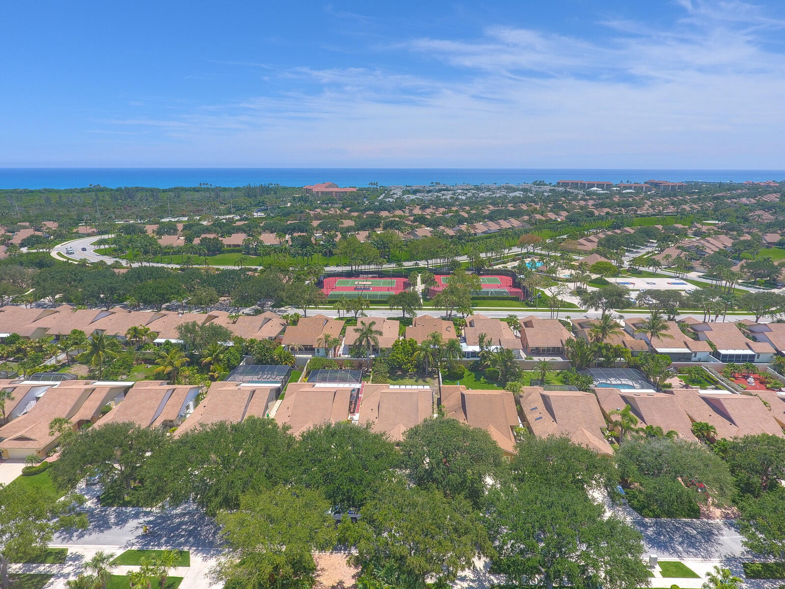 an aerial view of lake and residential houses with outdoor space