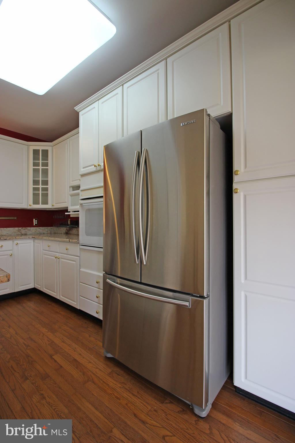 11799 Valley Ridge Circle Fairfax, VA 22033 - Photo 12 of 43 a metallic refrigerator freezer sitting in a kitchen