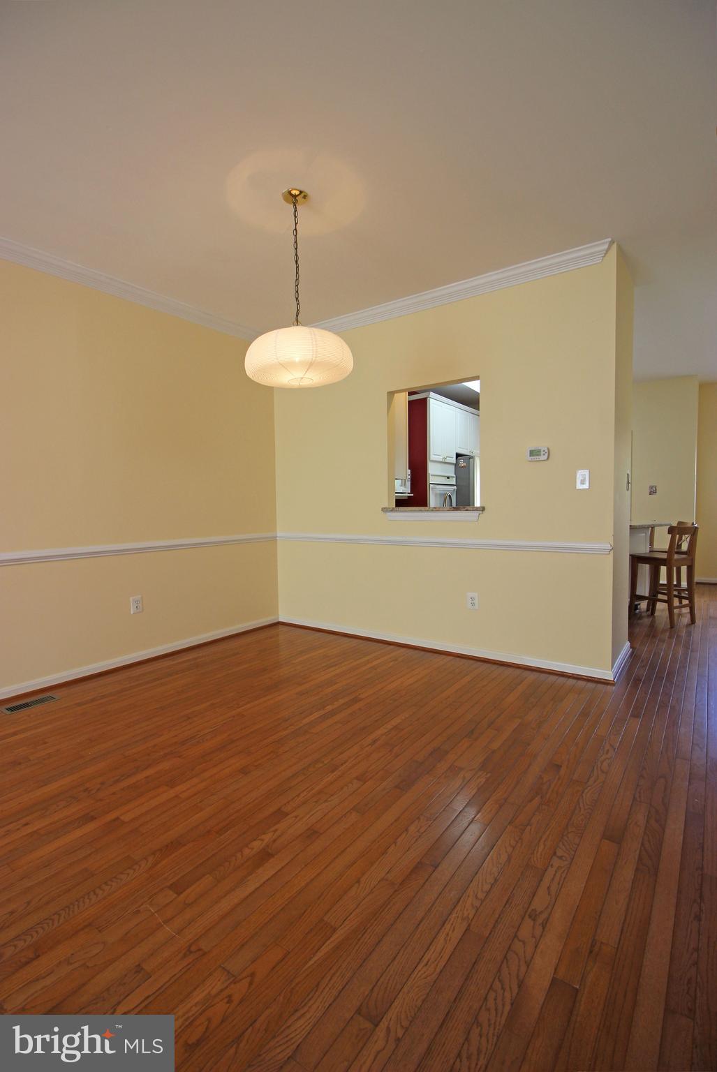 11799 Valley Ridge Circle Fairfax, VA 22033 - Photo 17 of 43 a view of an empty room with wooden floor and a window