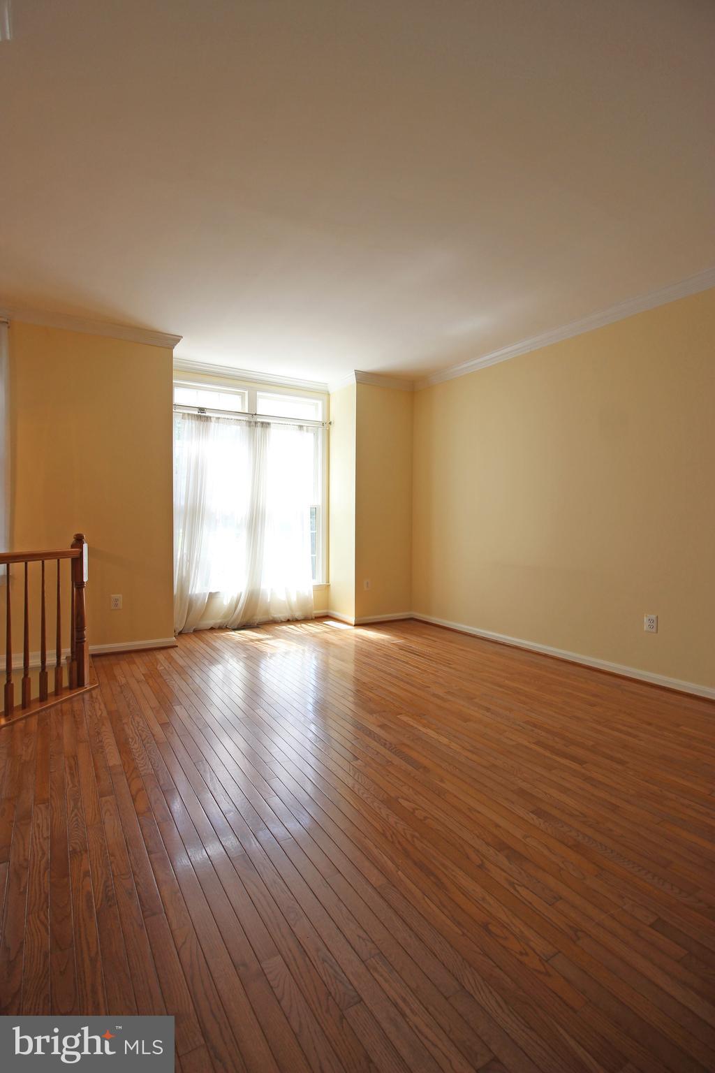 11799 Valley Ridge Circle Fairfax, VA 22033 - Photo 20 of 43 a view of empty room with wooden floor and fan