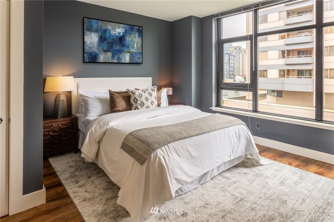 2911 2nd Avenue, Unit 903 Seattle, WA 98121 - Photo 13 of 25 a bedroom with a bed and a large window