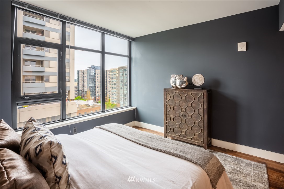 2911 2nd Avenue, Unit 903 Seattle, WA 98121 - Photo 14 of 25 a bedroom with a bed and a large window