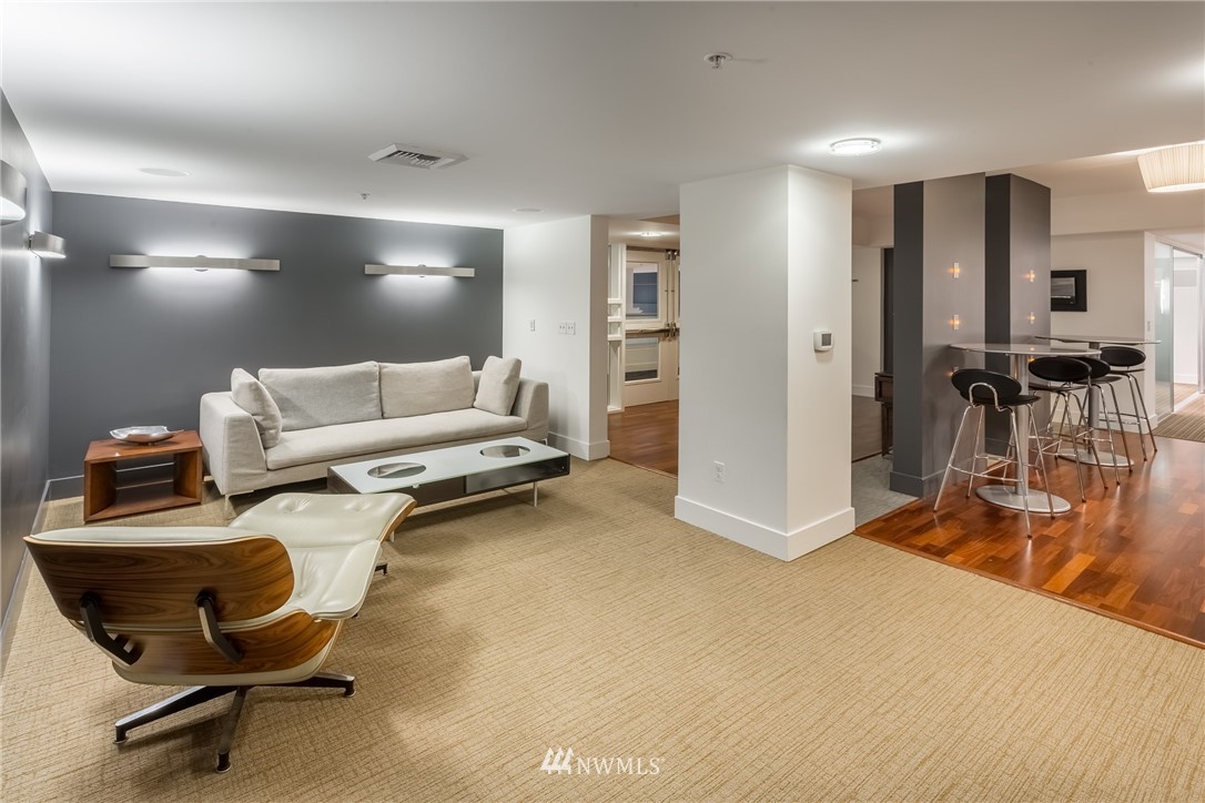 2911 2nd Avenue, Unit 903 Seattle, WA 98121 - Photo 21 of 25 a living room with furniture and a table