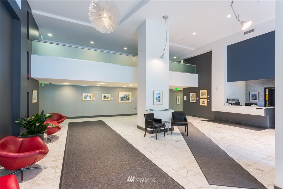 2911 2nd Avenue, Unit 903 Seattle, WA 98121 - Photo 24 of 25 a lobby with furniture and a potted plant