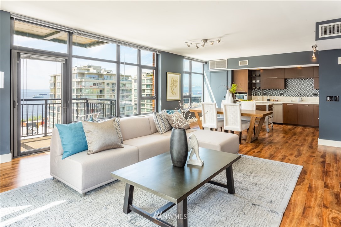 2911 2nd Avenue, Unit 903 Seattle, WA 98121 - Photo 6 of 25 a living room with furniture and a large window
