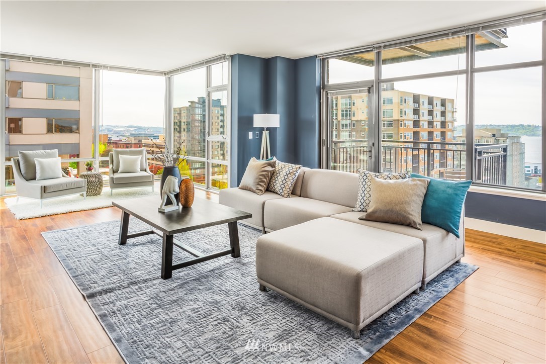 2911 2nd Avenue, Unit 903 Seattle, WA 98121 - Photo 7 of 25 a living room with furniture and a large window