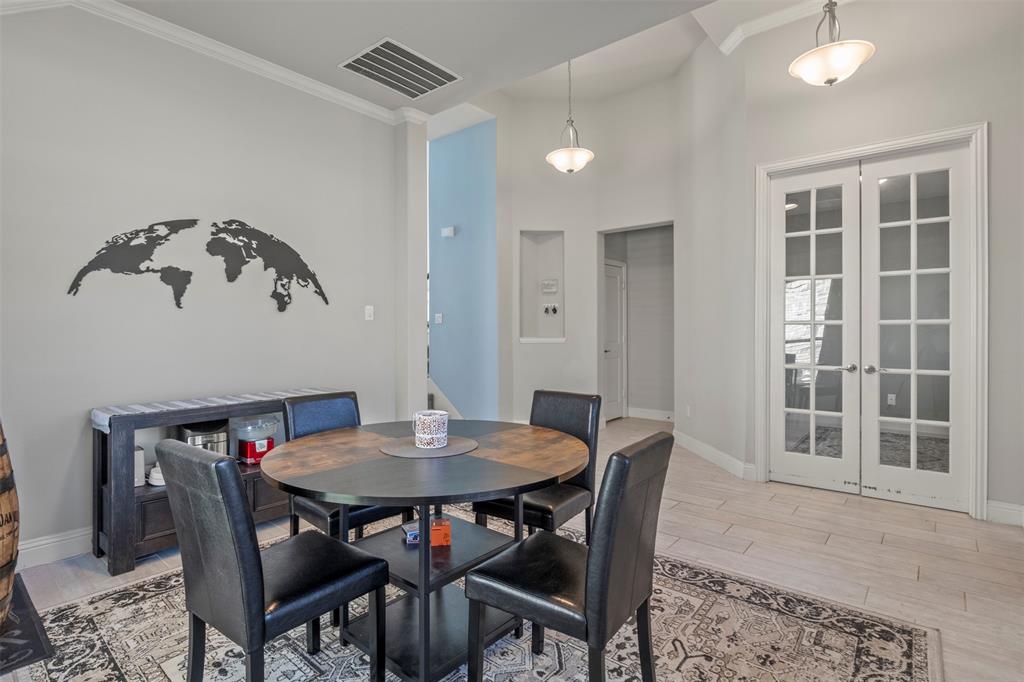 4002 Magnolia Ridge Drive Melissa, TX 75454 - Photo 11 of 36 a view of a dining room with furniture and wooden floor