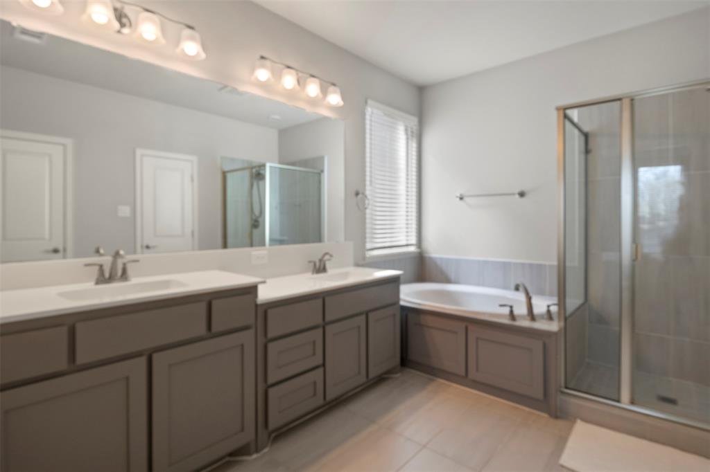 4002 Magnolia Ridge Drive Melissa, TX 75454 - Photo 14 of 36 a bathroom with a double vanity sink mirror and bathtub