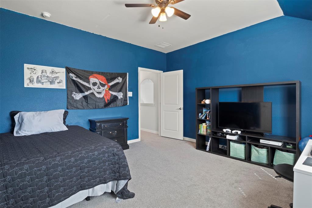 4002 Magnolia Ridge Drive Melissa, TX 75454 - Photo 18 of 36 a living room with furniture and a flat screen tv