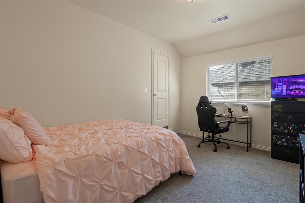 4002 Magnolia Ridge Drive Melissa, TX 75454 - Photo 19 of 36 a bedroom with a bed and a workspace
