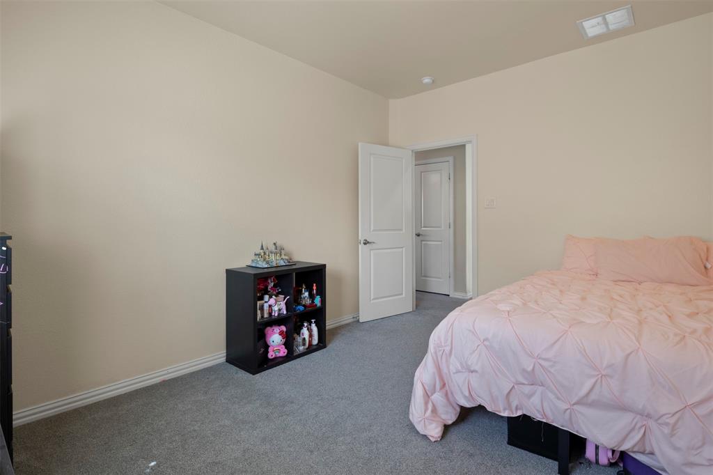 4002 Magnolia Ridge Drive Melissa, TX 75454 - Photo 20 of 36 a bed room with a bed and a chair