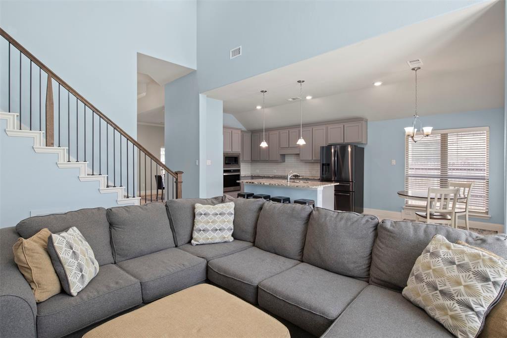 4002 Magnolia Ridge Drive Melissa, TX 75454 - Photo 6 of 36 a living room with a couch and kitchen view