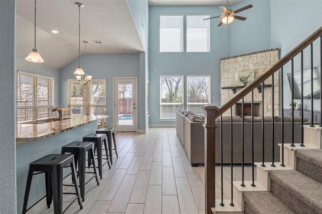 4002 Magnolia Ridge Drive Melissa, TX 75454 - Photo 7 of 36 a view of a hallway with furniture and a chandelier