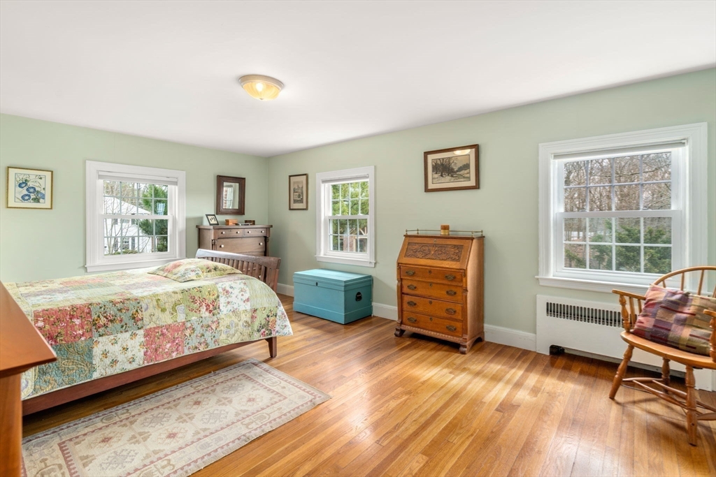 43 Palmer Road Newton, MA 02468 - Photo 14 of 40 a bedroom with a bed and a dresser next to a window