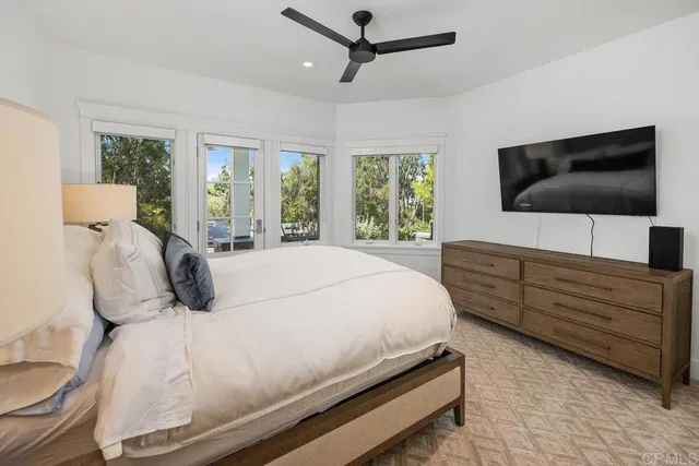 a bathroom with double vanity sink and mirror
