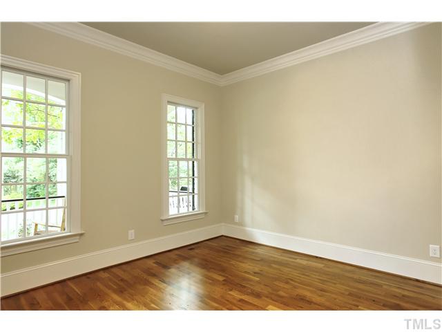 1500 Brooks Avenue Raleigh, NC 27607 - Photo 12 of 25 an empty room with wooden floor and windows