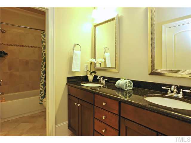 1500 Brooks Avenue Raleigh, NC 27607 - Photo 17 of 25 a bathroom with a granite countertop sink and a mirror