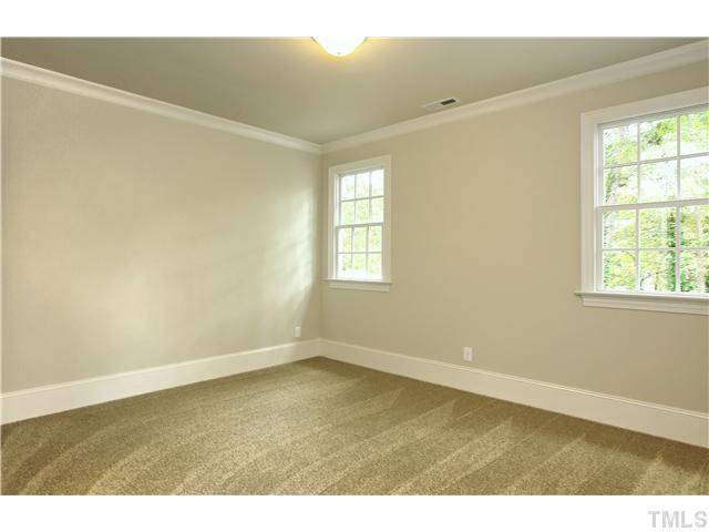 1500 Brooks Avenue Raleigh, NC 27607 - Photo 22 of 25 a view of an empty room with wooden floor and a window