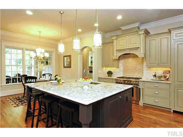 1500 Brooks Avenue Raleigh, NC 27607 - Photo 3 of 25 a kitchen with a stove a sink and a refrigerator