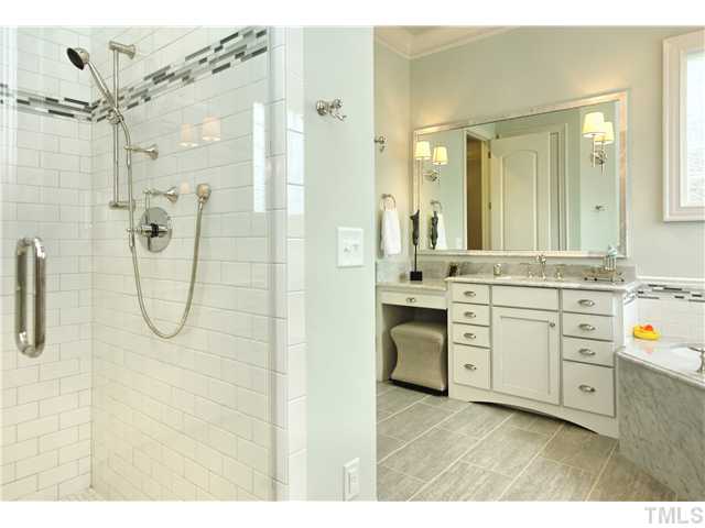 1500 Brooks Avenue Raleigh, NC 27607 - Photo 9 of 25 a bathroom with a granite countertop sink a shower a mirror and a bathtub