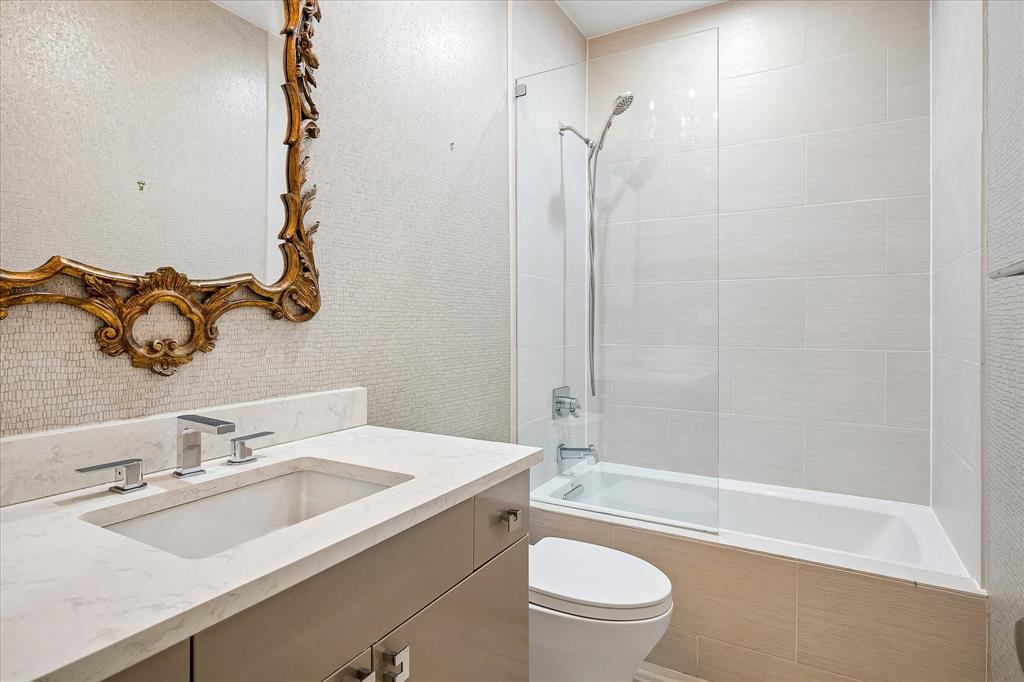12680 Hillcrest Road, Unit 1109 Dallas, TX 75230 - Photo 18 of 22 Guest bathroom remodeled including acrylic cabinets.
