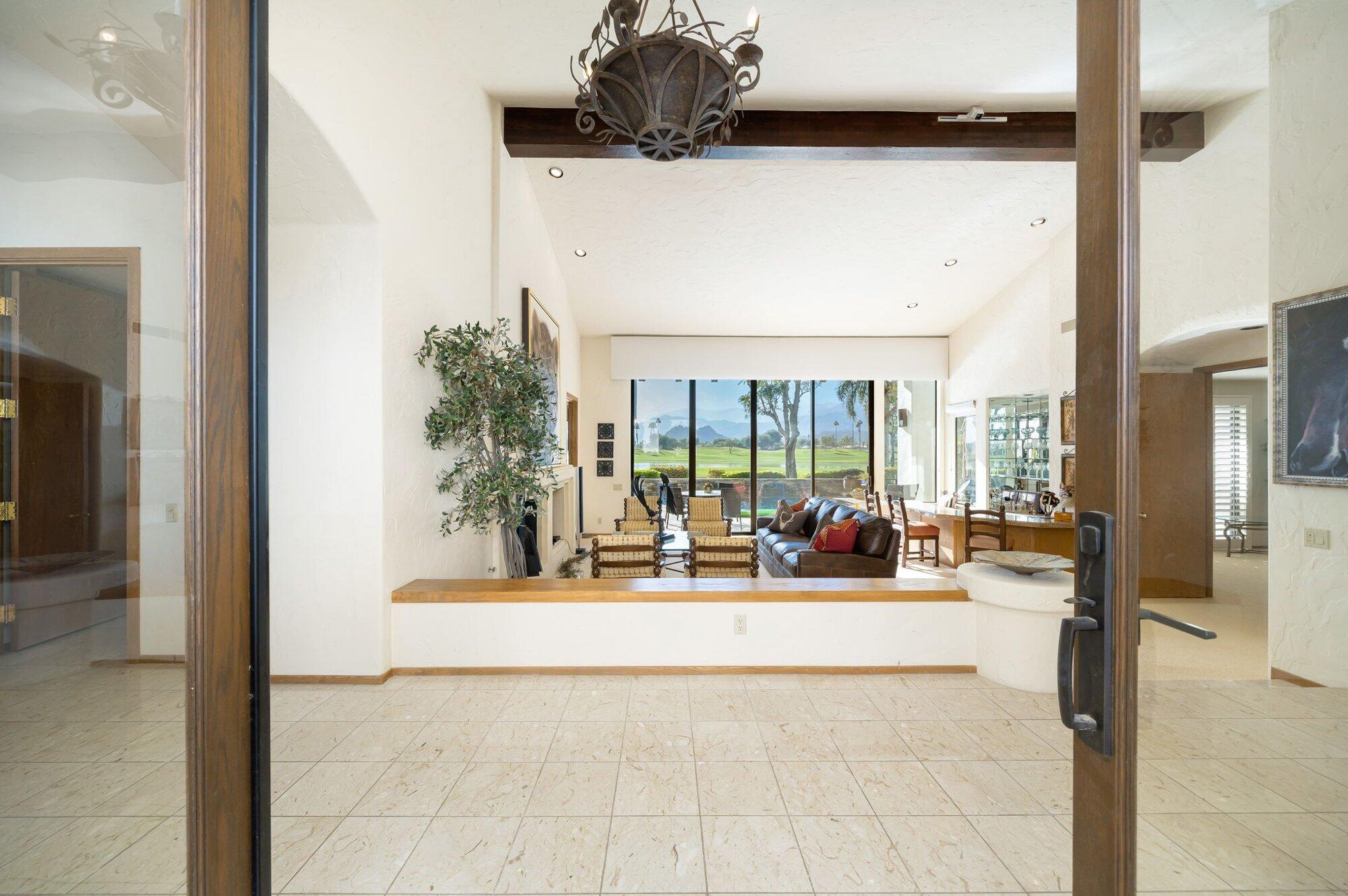 55880 Pinehurst La Quinta, CA 92253 - Photo 16 of 54 a living room with furniture and a floor to ceiling window