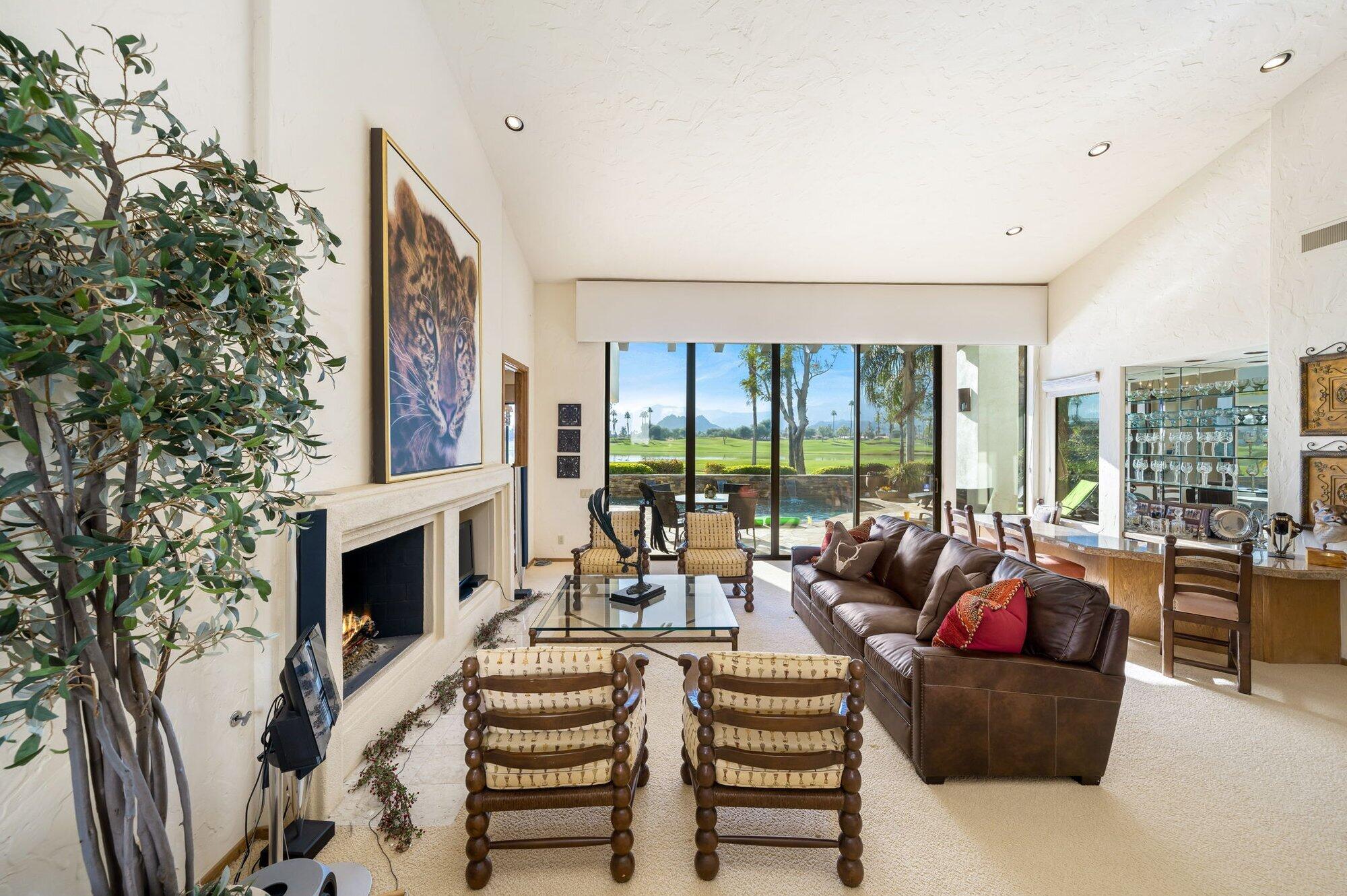 55880 Pinehurst La Quinta, CA 92253 - Photo 17 of 54 a living room with fireplace furniture and a large window