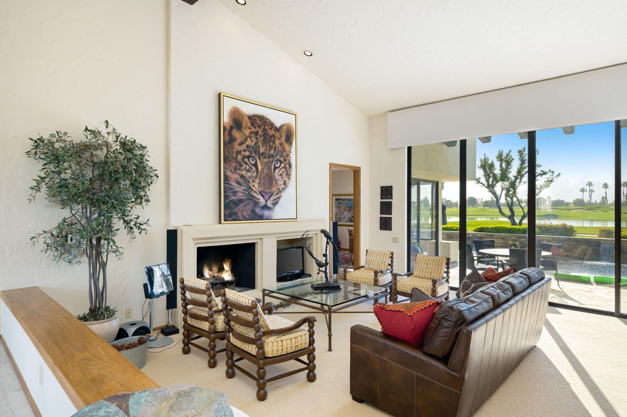 55880 Pinehurst La Quinta, CA 92253 - Photo 18 of 54 a living room with furniture potted plant and a fireplace