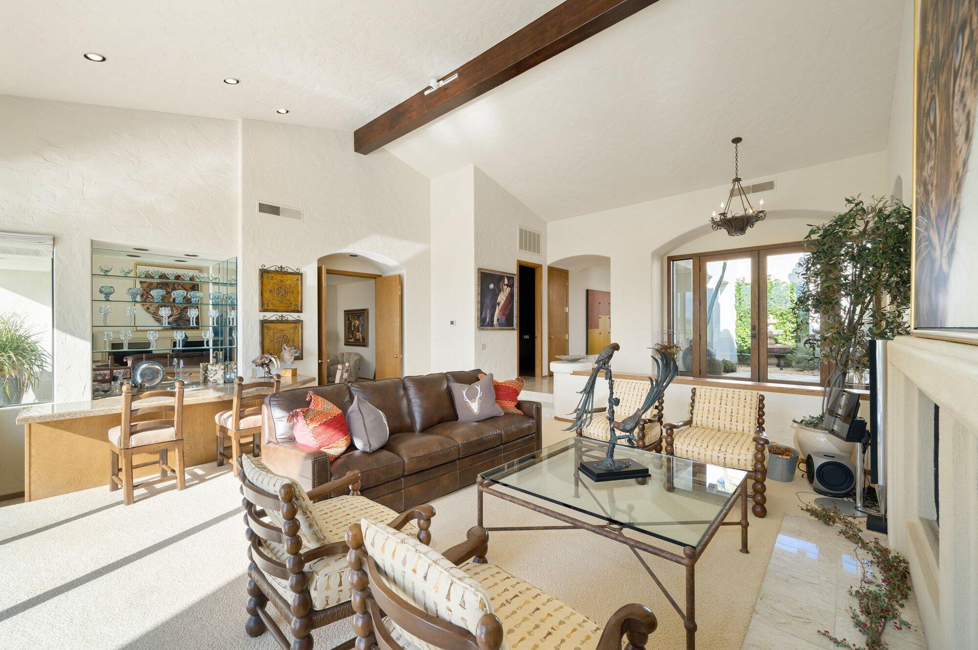 55880 Pinehurst La Quinta, CA 92253 - Photo 22 of 54 a living room with fireplace furniture and a large window