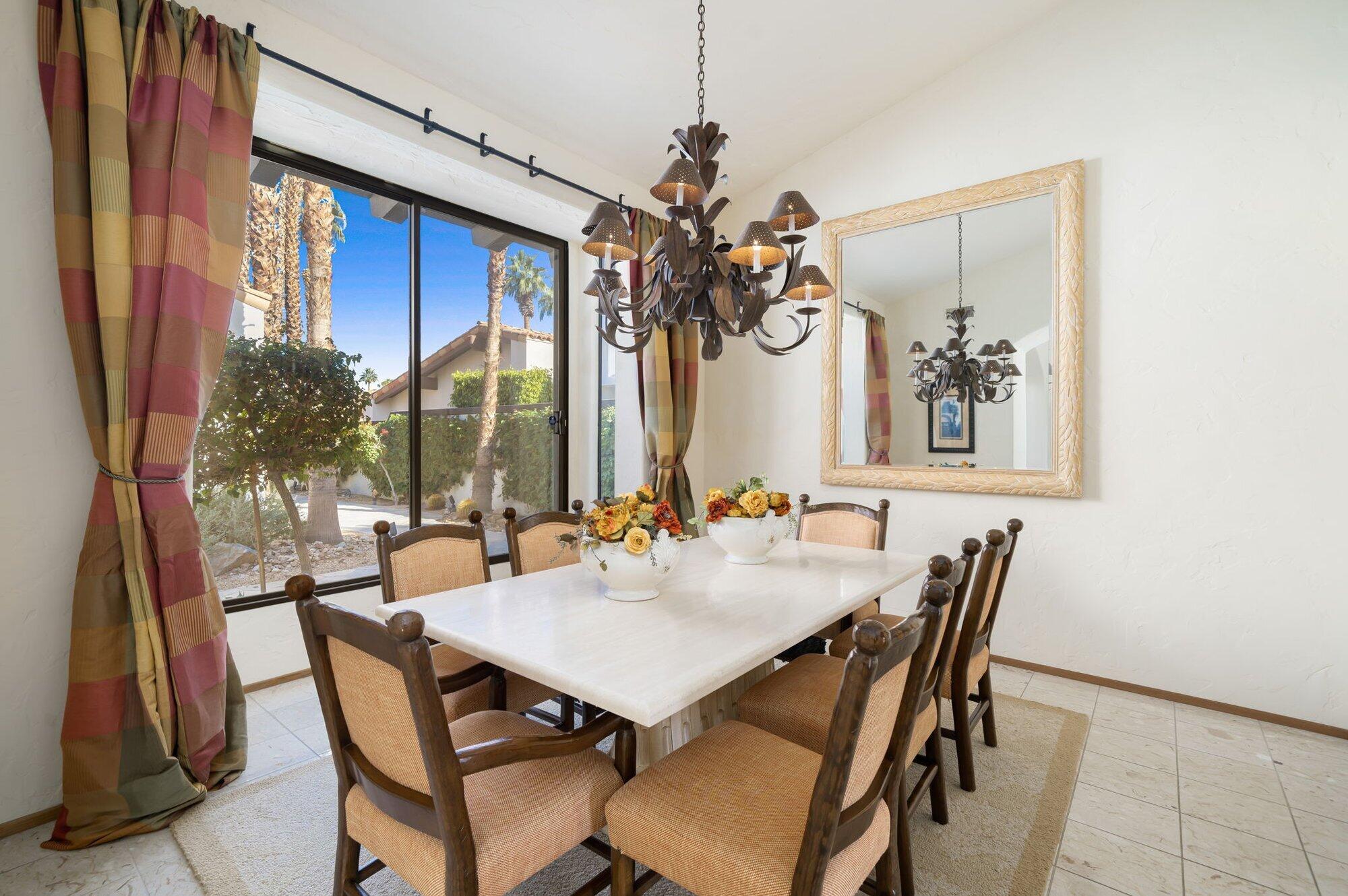 55880 Pinehurst La Quinta, CA 92253 - Photo 24 of 54 a view of a dining room with furniture and window