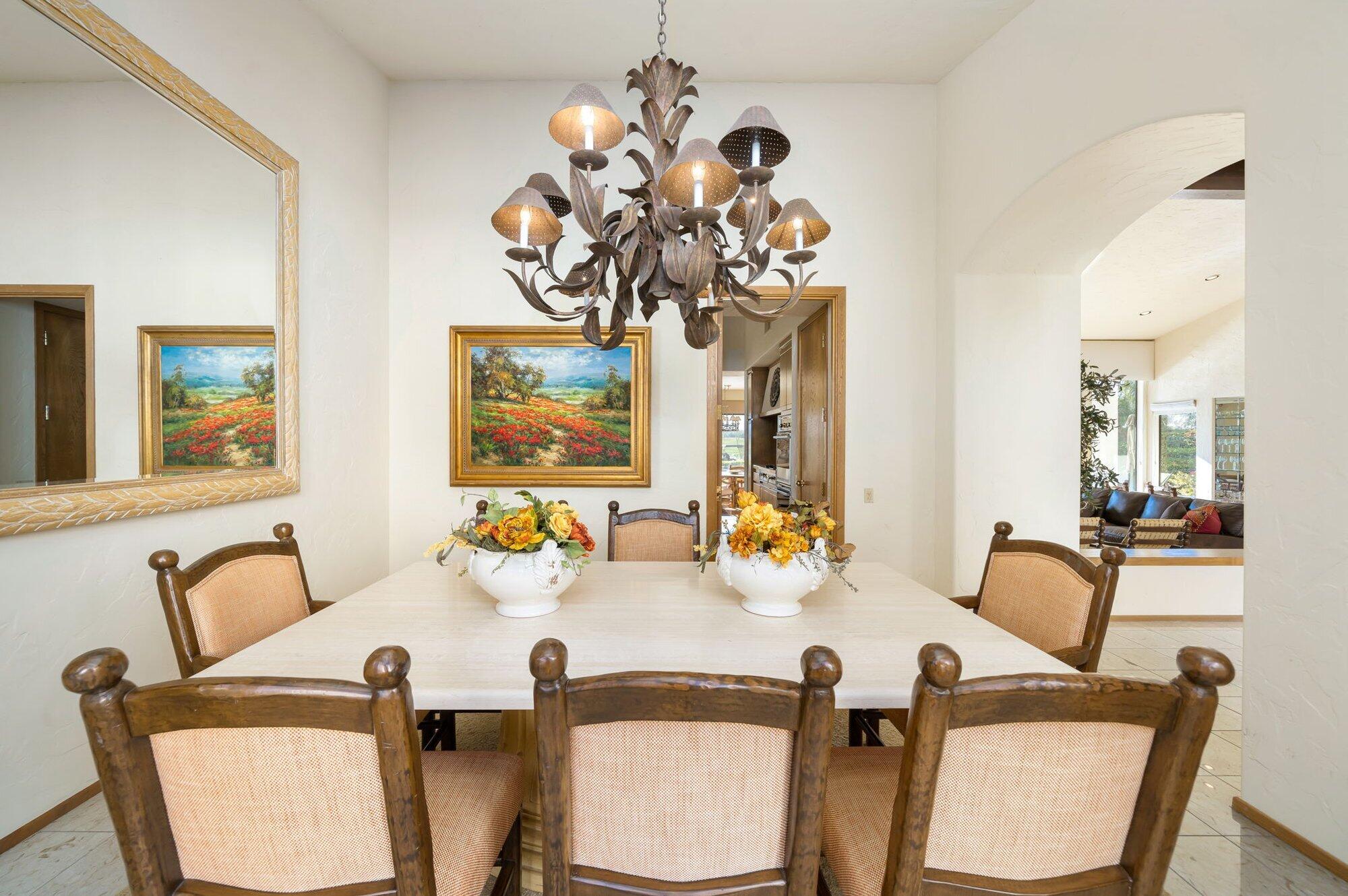 55880 Pinehurst La Quinta, CA 92253 - Photo 25 of 54 a view of a dining room with furniture and chandelier