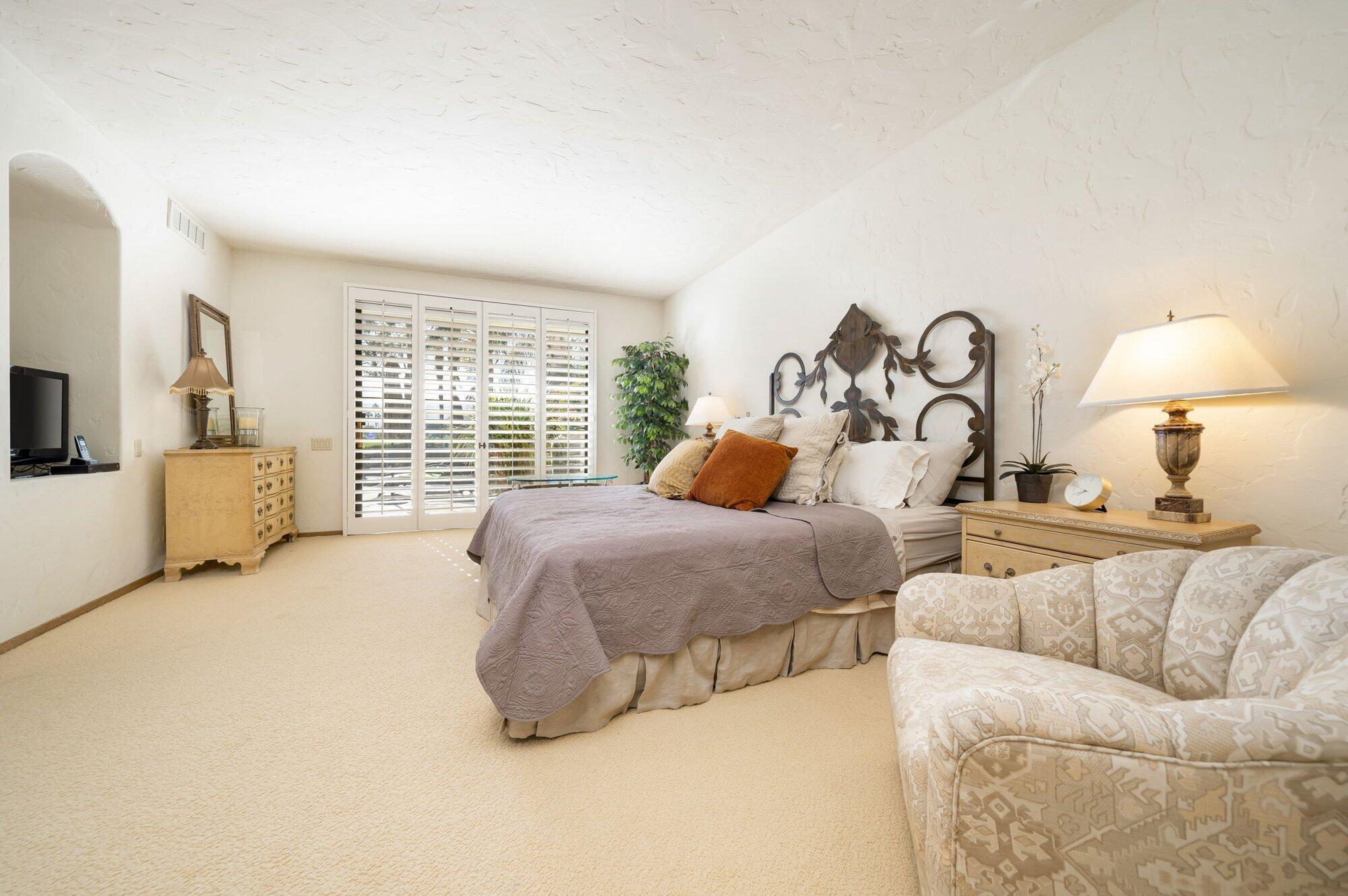 55880 Pinehurst La Quinta, CA 92253 - Photo 34 of 54 a bed room with a bed and a couch