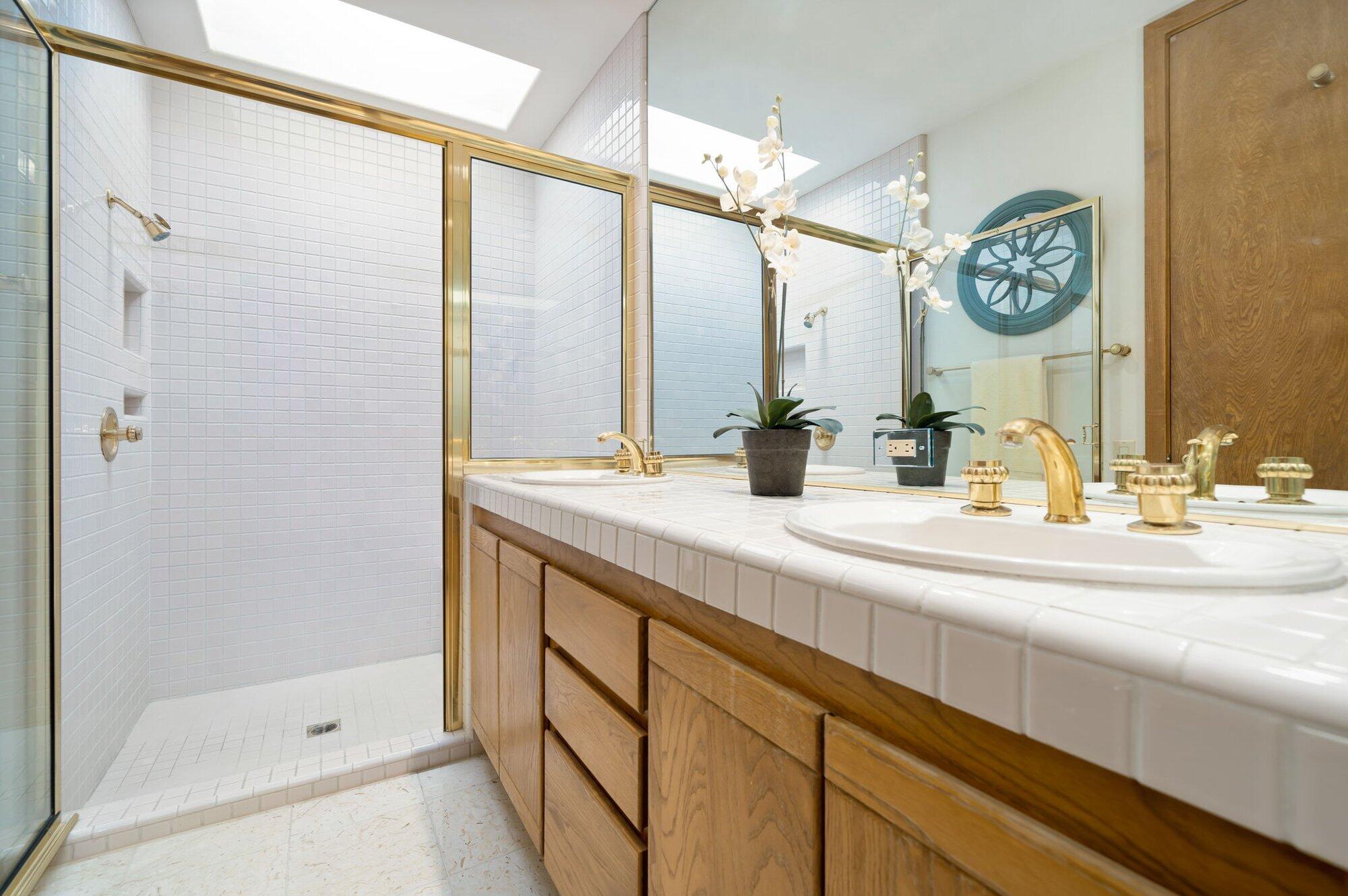 55880 Pinehurst La Quinta, CA 92253 - Photo 36 of 54 a bathroom with a sink and a mirror