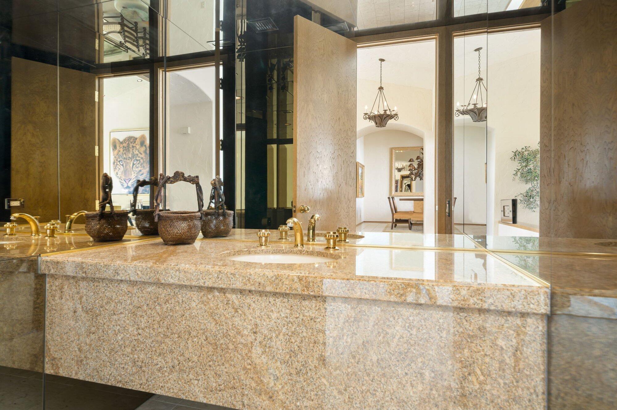 55880 Pinehurst La Quinta, CA 92253 - Photo 37 of 54 a bathroom with a granite countertop sink and a mirror