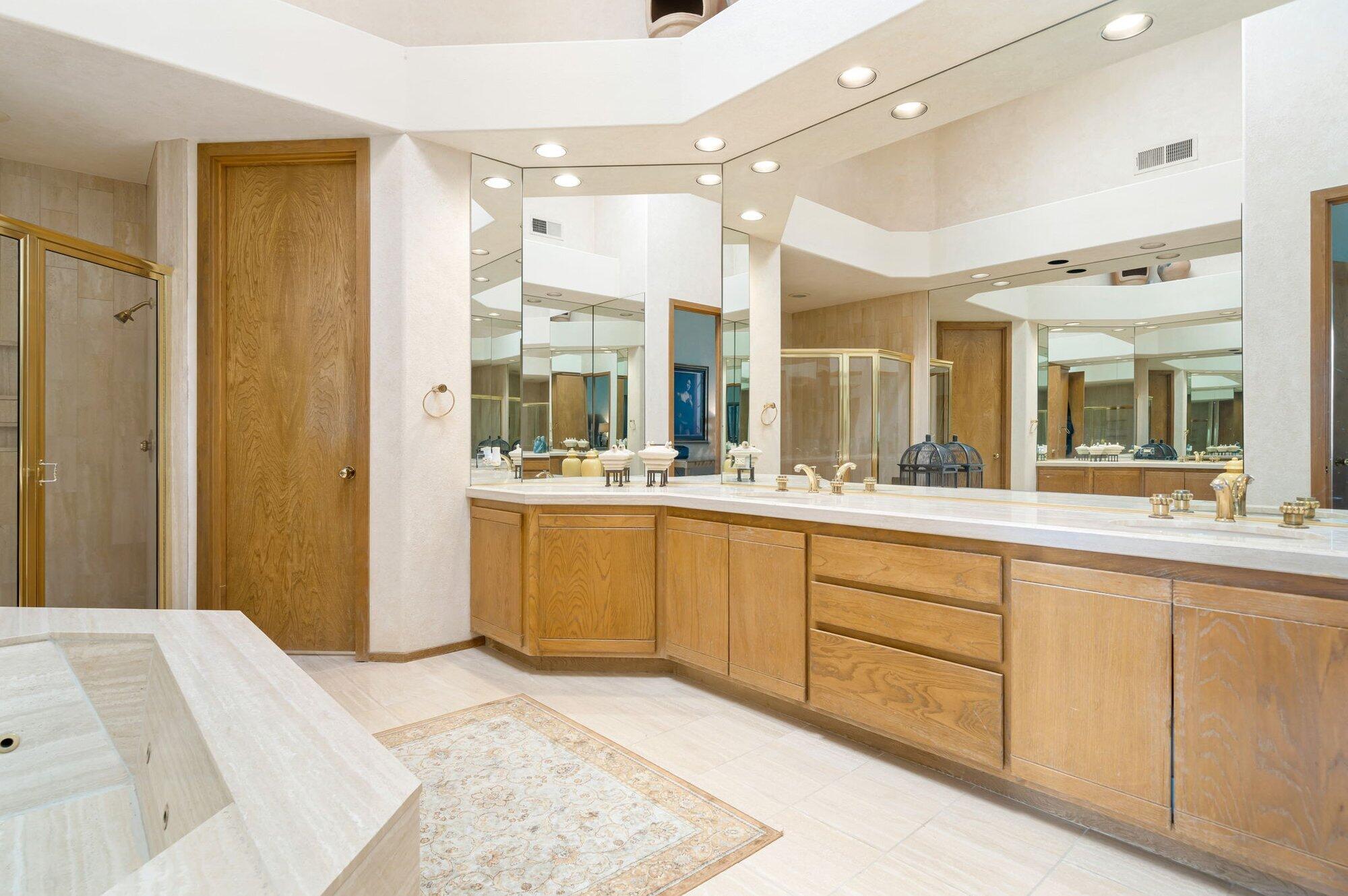 55880 Pinehurst La Quinta, CA 92253 - Photo 40 of 54 a spacious bathroom with a mirror sink and shower