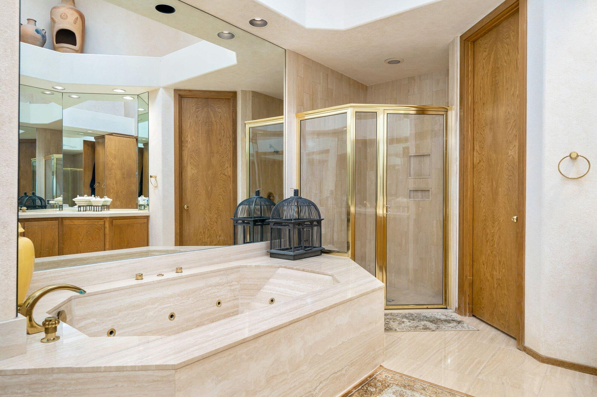 55880 Pinehurst La Quinta, CA 92253 - Photo 41 of 54 a bathroom with a tub sink and mirror