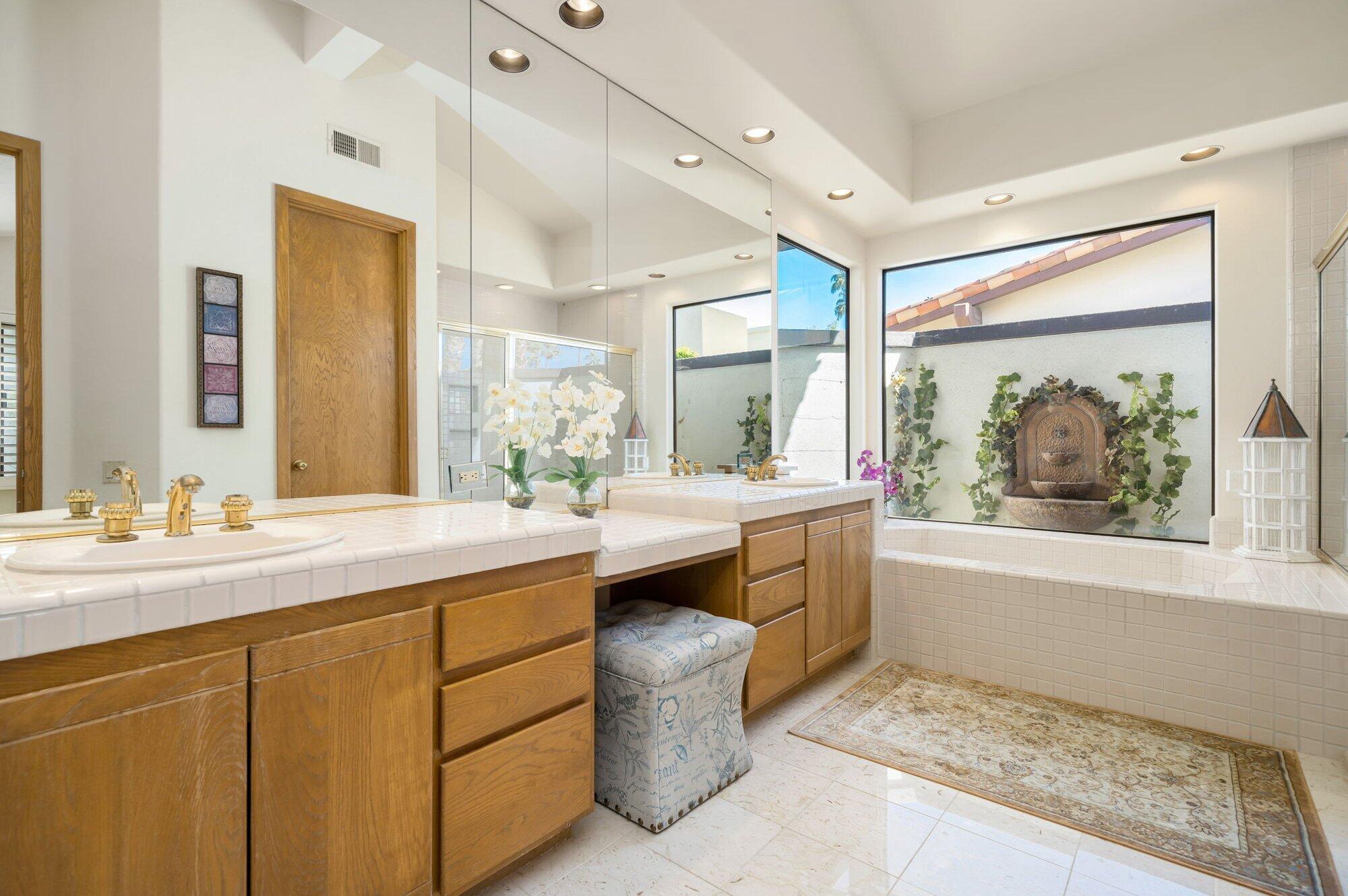 55880 Pinehurst La Quinta, CA 92253 - Photo 43 of 54 a bathroom with a sink and a mirror
