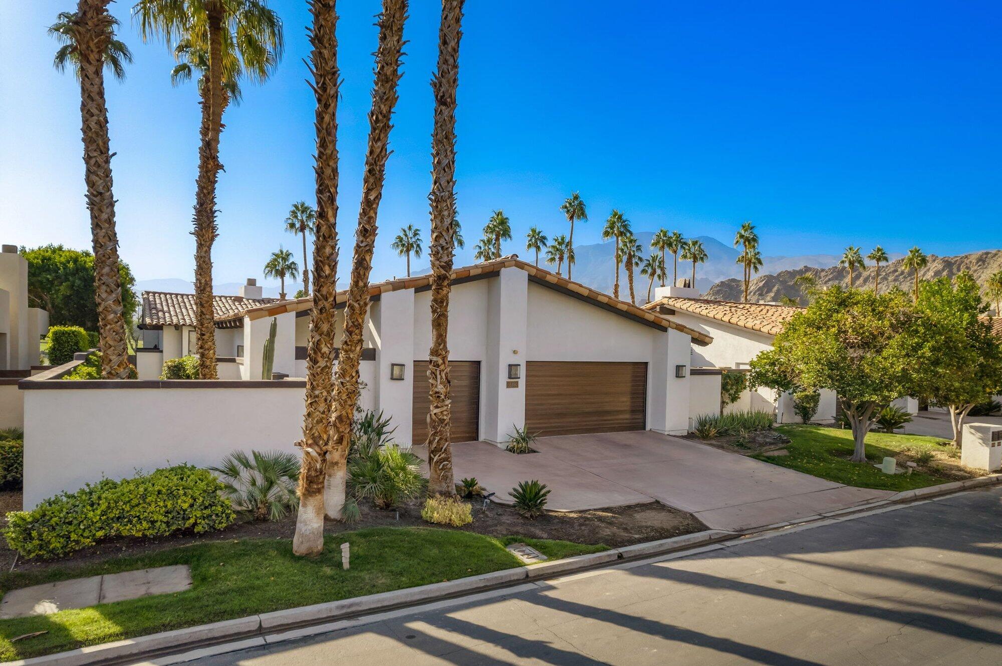 55880 Pinehurst La Quinta, CA 92253 - Photo 51 of 54 front view of a house with a yard