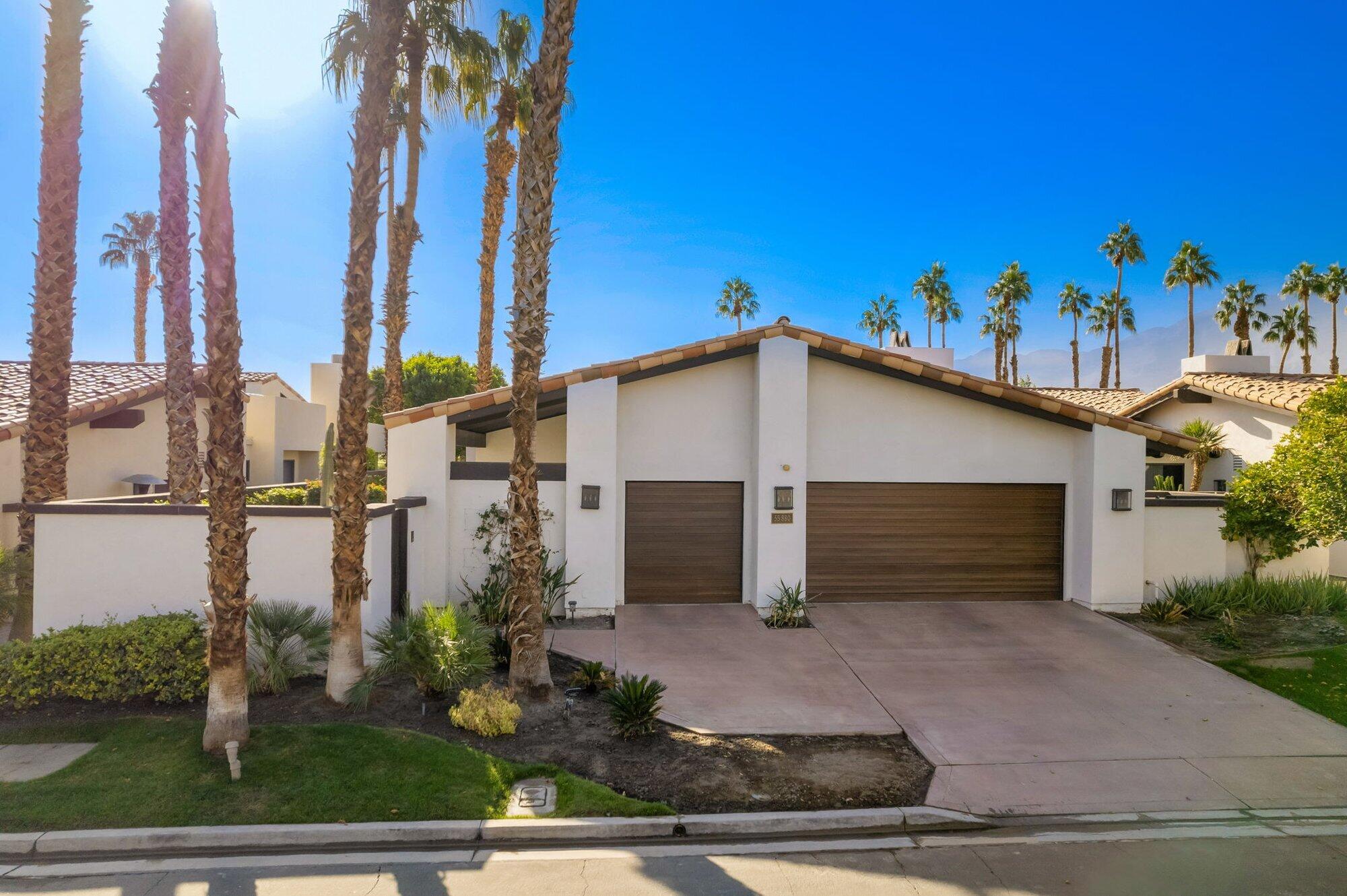 55880 Pinehurst La Quinta, CA 92253 - Photo 52 of 54 a view of a house with a yard and potted plants