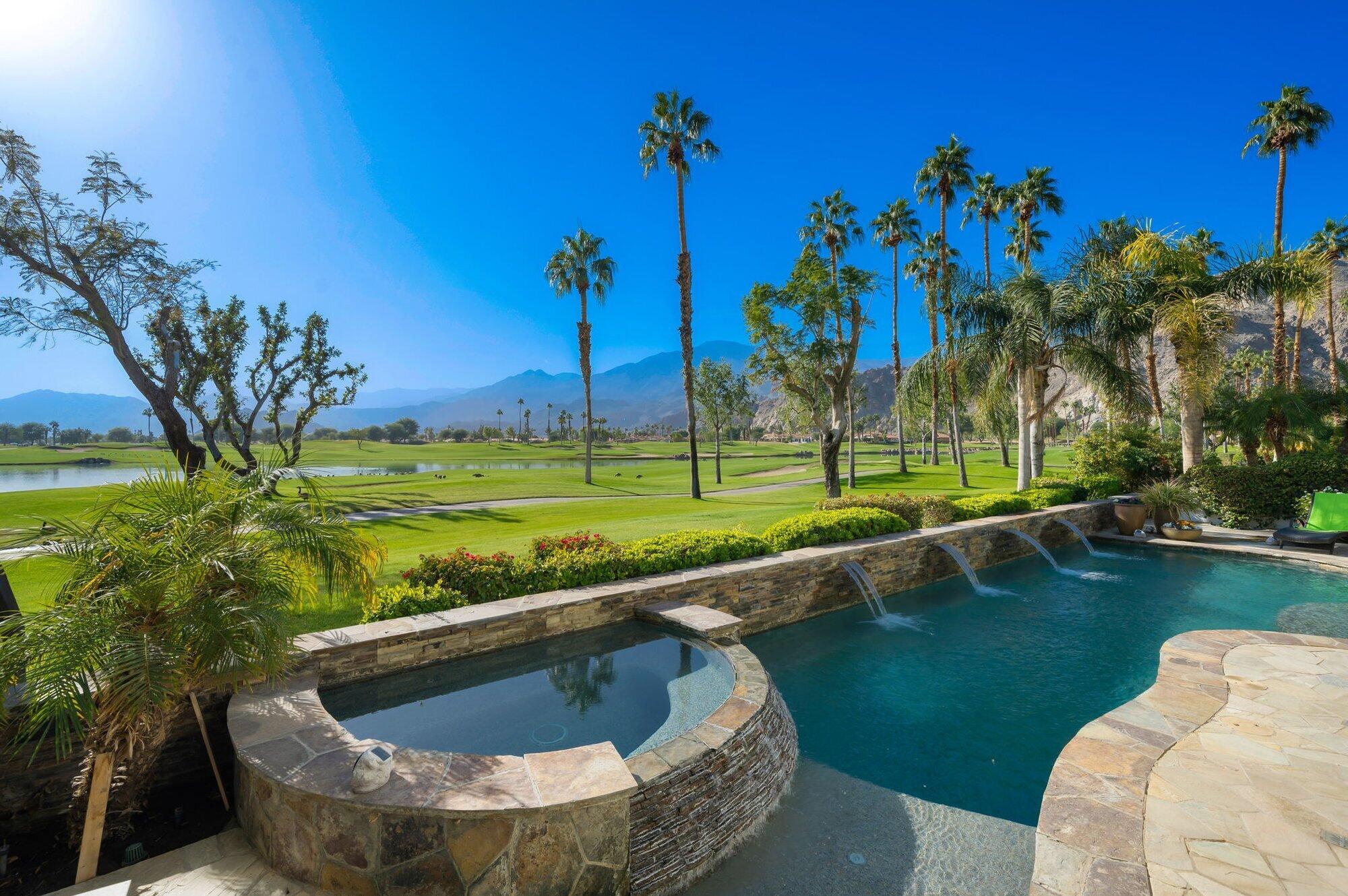55880 Pinehurst La Quinta, CA 92253 - Photo 6 of 54 a view of a swimming pool with a garden