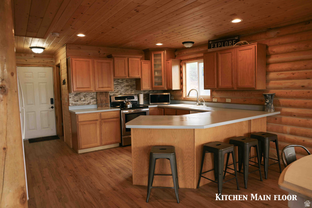 15253 Mill Road, Unit 62 Huntsville, UT 84317 - Photo 14 of 48 Kitchen featuring wood-finish flooring, wood plank ceiling, and log wall construction