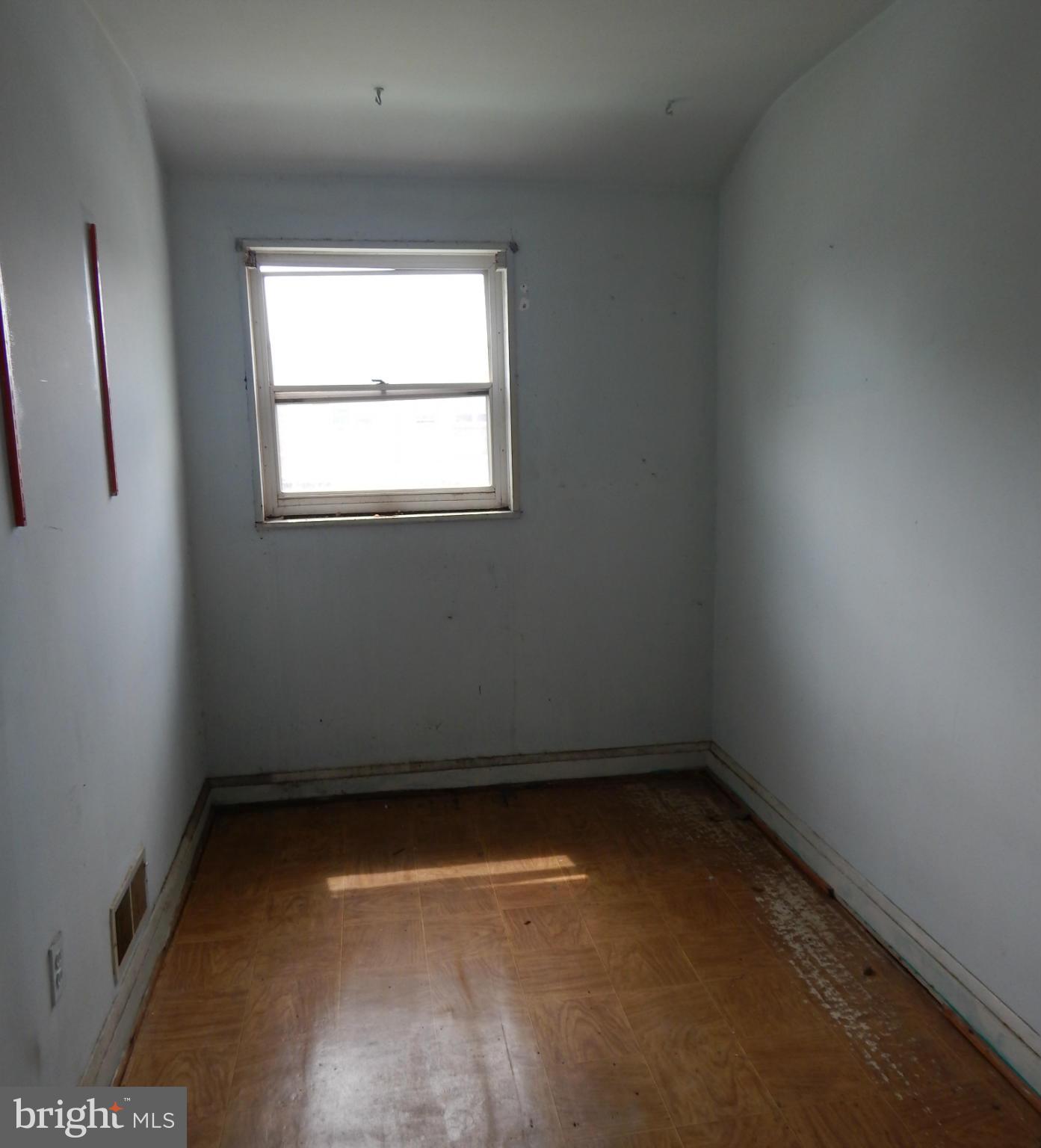 1918 Jasmine Road Dundalk, MD 21222 - Photo 8 of 12 an empty room with a window