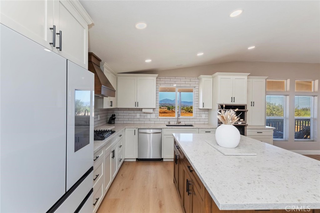 19310 Ann Way Perris, CA 92570 - Photo 17 of 75 a kitchen with counter top space cabinets and stainless steel appliances