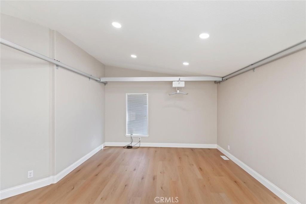 19310 Ann Way Perris, CA 92570 - Photo 34 of 75 an empty room with wooden floor and windows