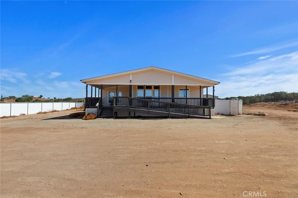 19310 Ann Way Perris, CA 92570 - Photo 44 of 75 a front view of a house with a yard