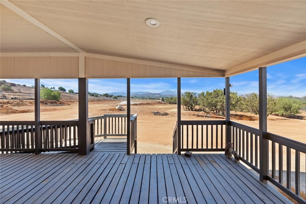 19310 Ann Way Perris, CA 92570 - Photo 7 of 75 a view of a large room with wooden floor and city view